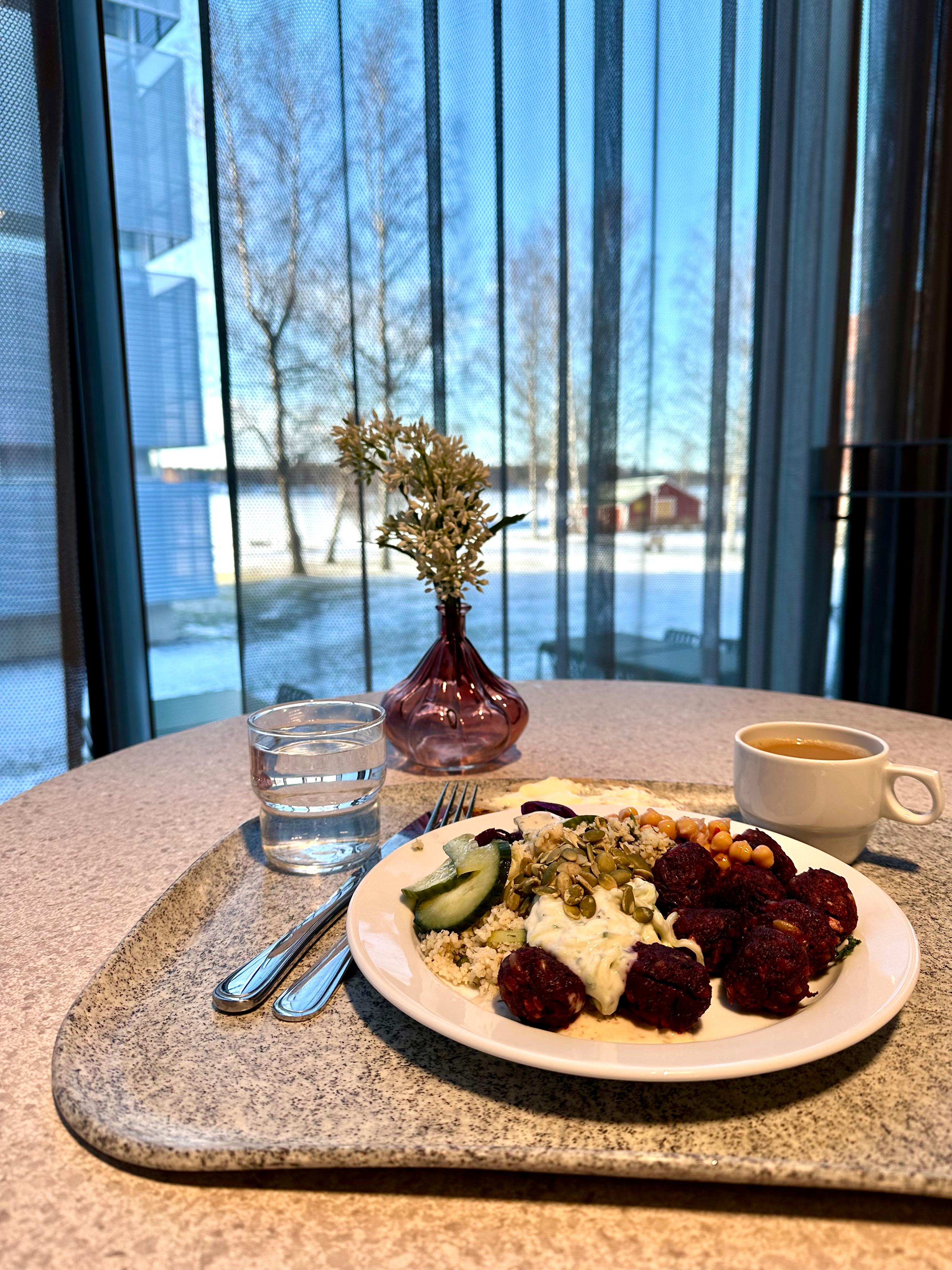 University cafeteria with students enjoying lunch